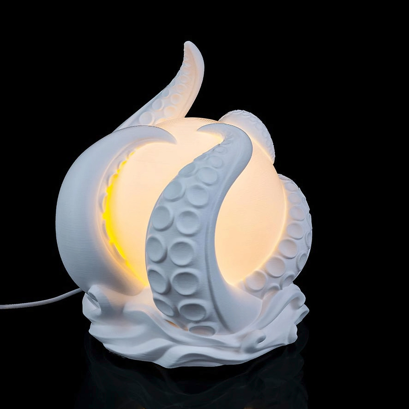 Squid globe night light with tentacles curled around a glowing orb.